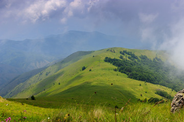 Fototapeta na wymiar Beautiful view of green hills and blue sky