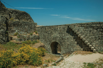 Wall made of stone bricks with gateway at the Castle of Monsanto
