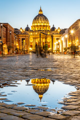 Vatican City by night. Illuminated dome of St Peters Basilica and St Peters Square. Group of tourists on Via della Conciliazione. Rome, Italy © pyty