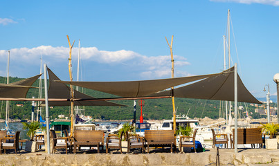 Beach with umbrellas and sun beds, ready for the summer. Croatia Opatija.