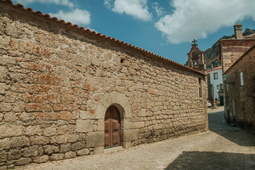 Old church with stone wall and bell at Monsanto