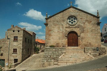 Fototapeta na wymiar Medieval church facade with stone wall at Monsanto