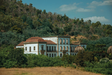 Fototapeta na wymiar Ruined facade of abandoned building on a farm near Monsanto