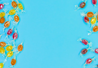 Tasty candies isolated on electric blue background