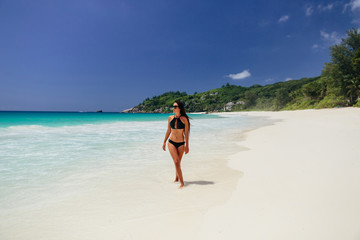 Fototapeta na wymiar woman relax on beach of tropical island
