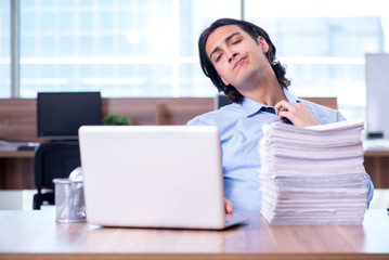 Young employee unhappy with excessive work 