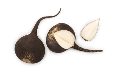 Black radish with slices isolated on white background. Top view. Flat lay