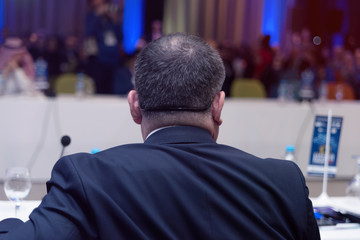 Businessman at business conference room with public giving presentations. Audience at the conference hall. Entrepreneurship club.