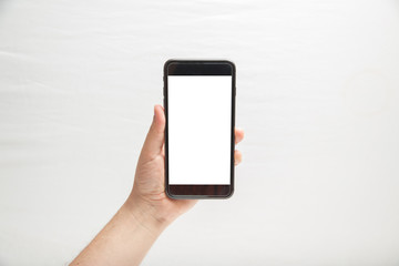 man hand holding black smartphone with blank screen isolated on white background with clipping path