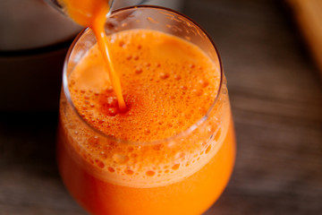 process of making juice in a juicer, process preparation of fresh juice in juicer, carrot juice