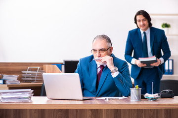 Young and old employees working together in the office 