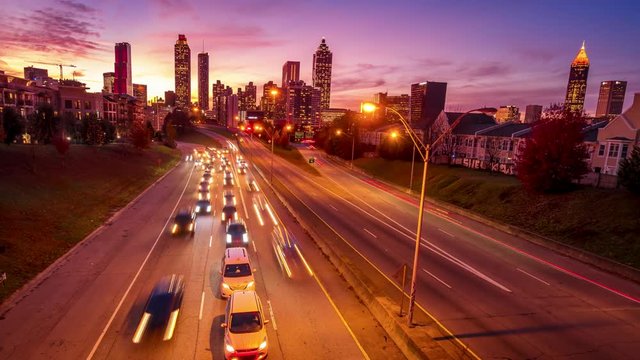 Atlanta, Georgia City Skyline and Freeway at Rush Hour, Sunset as Night Falls, Time Lapse, logos blurred for commercial use