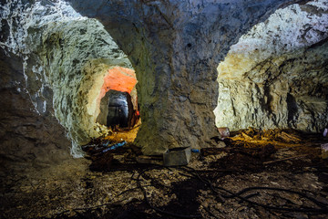 Dark and dirty abandoned uranium mine tunnel © Mulderphoto