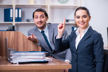 Two employees working in the office 
