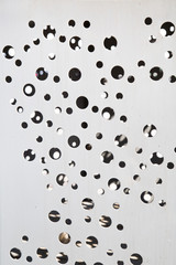 Steel plate with drilled holes. Background texture design.