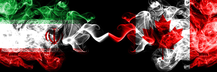 Iran vs Canada, Canadian smoky mystic states flags placed side by side. Thick colored silky smokes flag combination of Iranian and Canada, Canadian