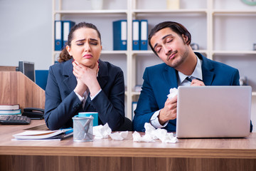 Two employees suffering at workplace 