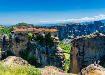 A monastery on top of a stone pillar