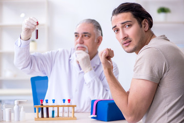 Young handsome man during blood test sampling procedure 