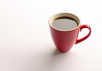 Black coffee in a red mug