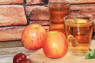 Grape and apple juice, fruit on a wooden background. Cool drinks, a mix of different varieties of grapes