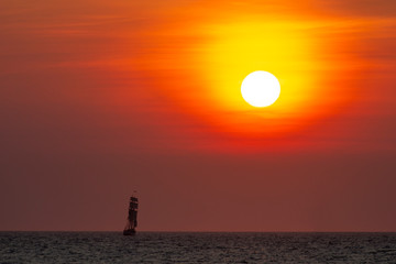 Tall ship, vessel, sailing and preparing the enter inside the harbor of Scheveningen at the vivid...