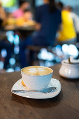hot coffee  on wood table in coffee bar