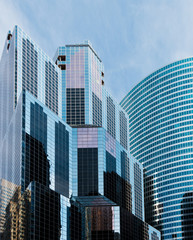 Stylized photo of mirrored office buildings in a city