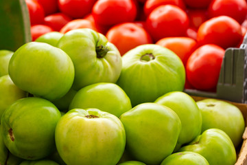 Green tomatoes at a local market