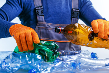 Worker sorting plastic garbage for recycling. Process plastic polymers sorting. Ecology. Concept