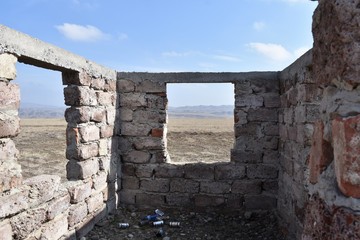 Stone Cattle Stall Interior with Discarded Cans, Republic of Georgia