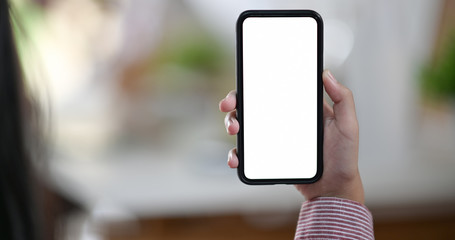 Woman holding blank screen mobile phone