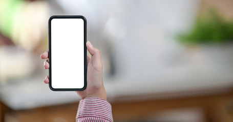 Woman holding blank screen mobile phone
