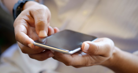 Close up of man using mobile smart phone