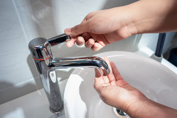 Health Hygienic Cleaning Hands Concept, Close-up Woman Hands is Washing Over Sink With Water Faucet for Healthy Hygiene and Anti Bacteria in Bathroom., Clean and Care Yourself 