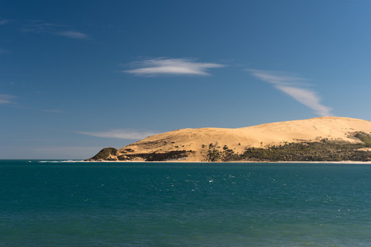 Massive sand dunes at the head of the Hokianga Harbour, viewed from Opononi, Northland, New Zealand.