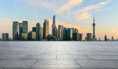 Panoramic skyline and buildings with empty concrete square floor in Shanghai
