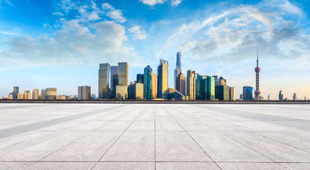 Shanghai skyline and modern city skyscrapers with empty floor at sunset,China