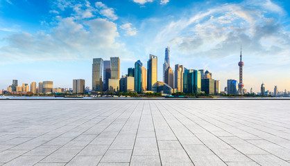 Obraz premium Shanghai skyline and modern city skyscrapers with empty floor at sunset,China