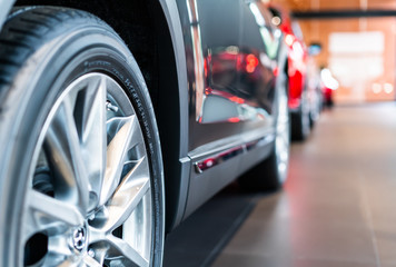 blur view of new modern car tire in showroom