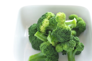 boiled broccoli on white background