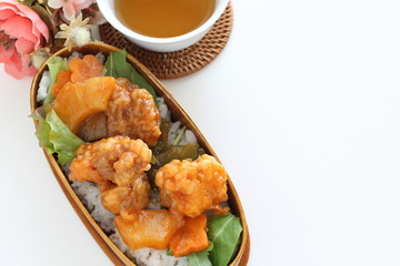 Chinese food, sweet and sour pork on rice for lunch box image