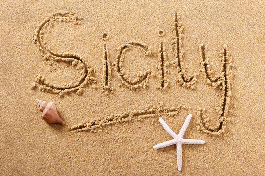 Sicily word written in sand on a sunny sicilian summer beach with starfish holiday vacation travel destination sign writing message photo