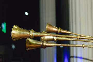 Karnay at the Uzbek wedding. Copper metal pipe music. National Uzbek brass instrument Karnay.