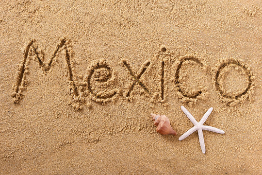 Mexico word written in sand on a sunny mexican summer beach with starfish holiday vacation travel destination sign writing message photo