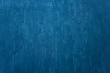 The texture of the blue wall. Artistic application of putty on the wall. Decorative wall in the...
