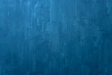 The texture of the blue wall. Artistic application of putty on the wall. Decorative wall in the...