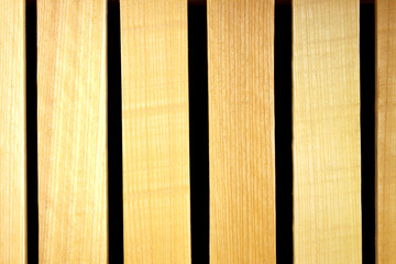 Wooden slats made of lime wood on a black background