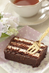 Chocolate cake on dish with copy space
