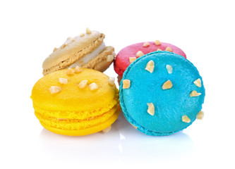 French colorful macarons isolated on white